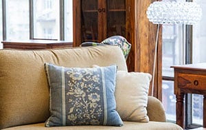 blue-pillows-on-brown-couch